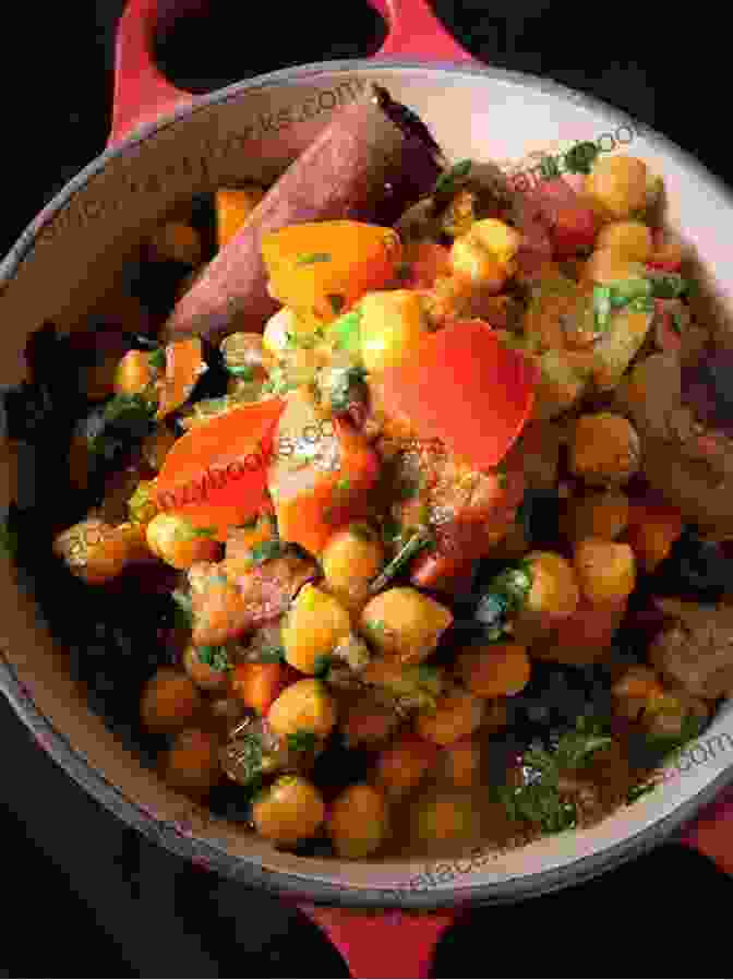 A Vibrant Image Of A Bowl Of Freshly Prepared Moroccan Chickpea Tagine The Hairy Bikers Veggie Feasts: Over 100 Delicious Vegetarian And Vegan Recipes Full Of Flavour And Meat Free